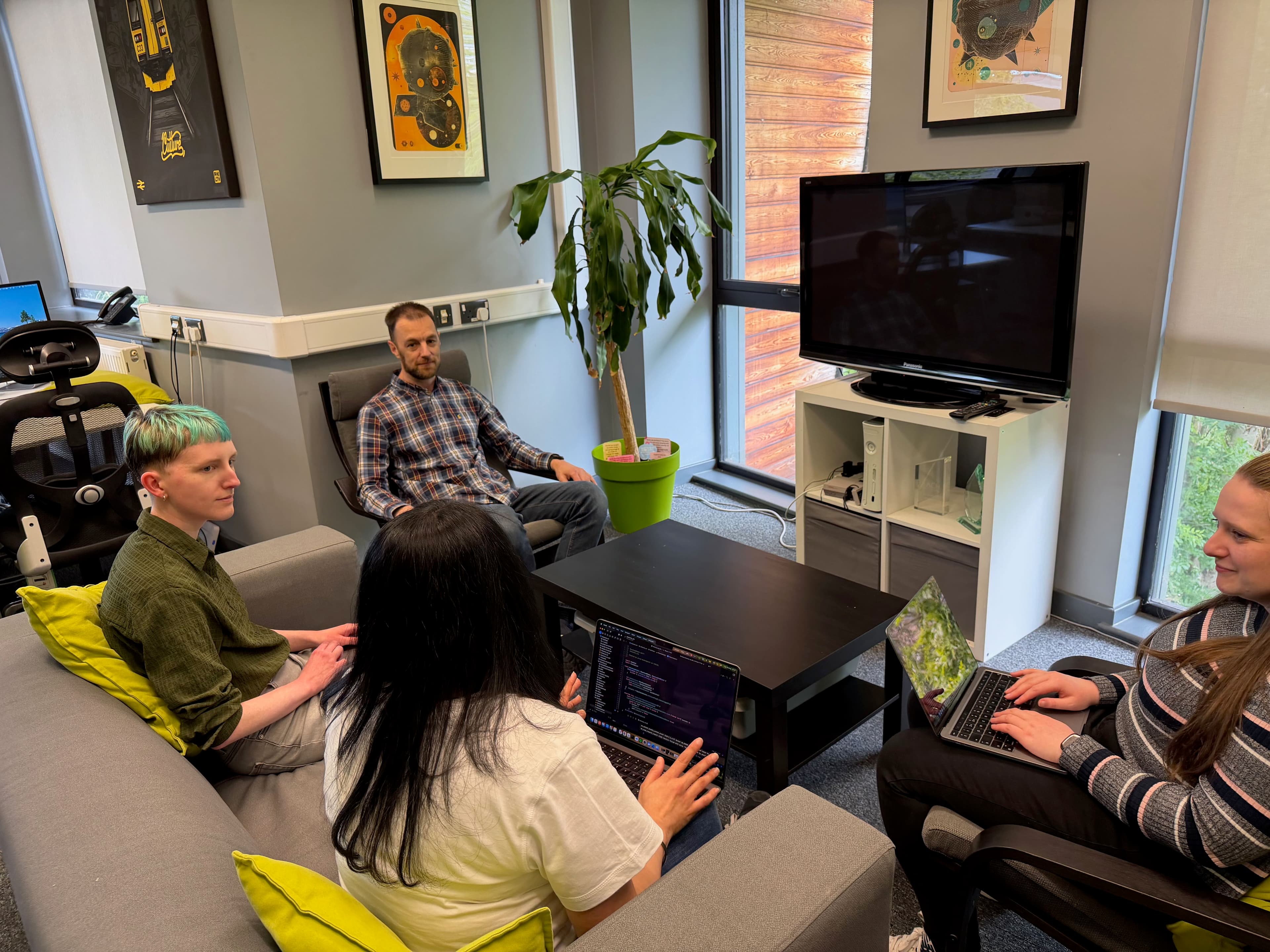 Software development team collaboration in office setting